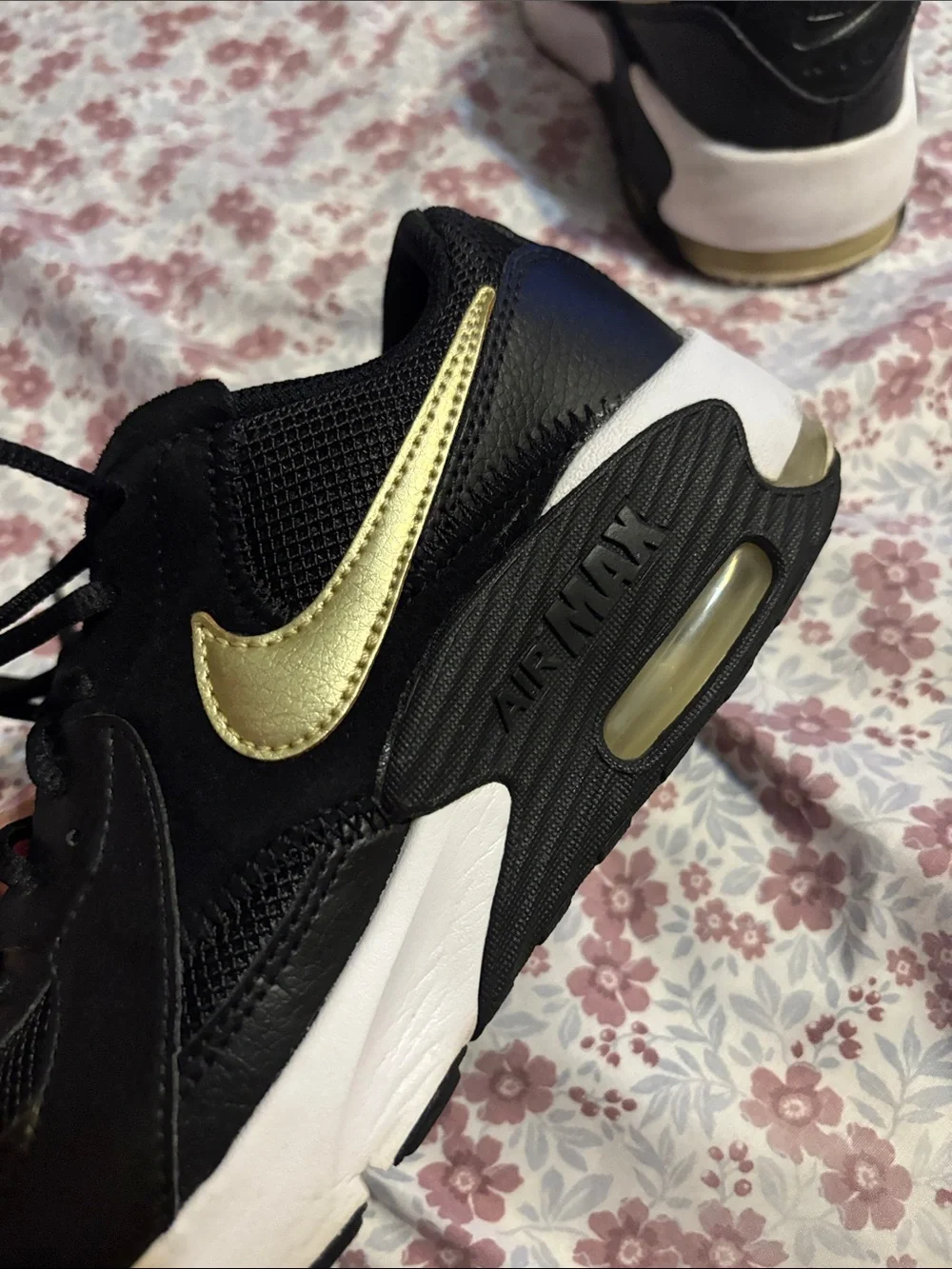 Nike Women's Black Sneakers with Subtle Gold Accent